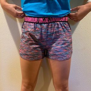 Colorful under armour shorts.